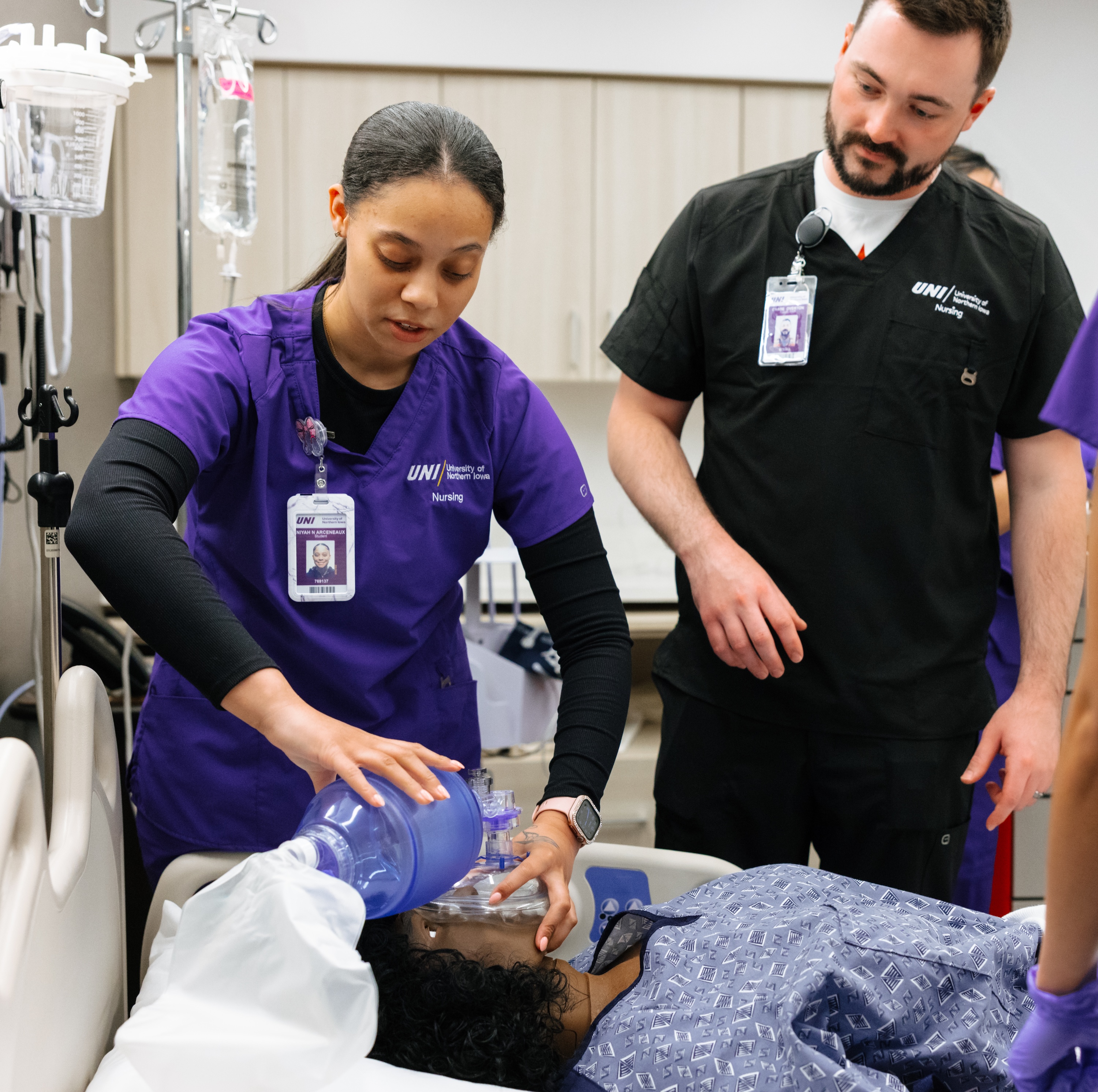 Nursing student and faculty in trauma simulation suite