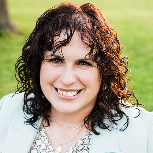 Rebecca Renze smiling outdoors
