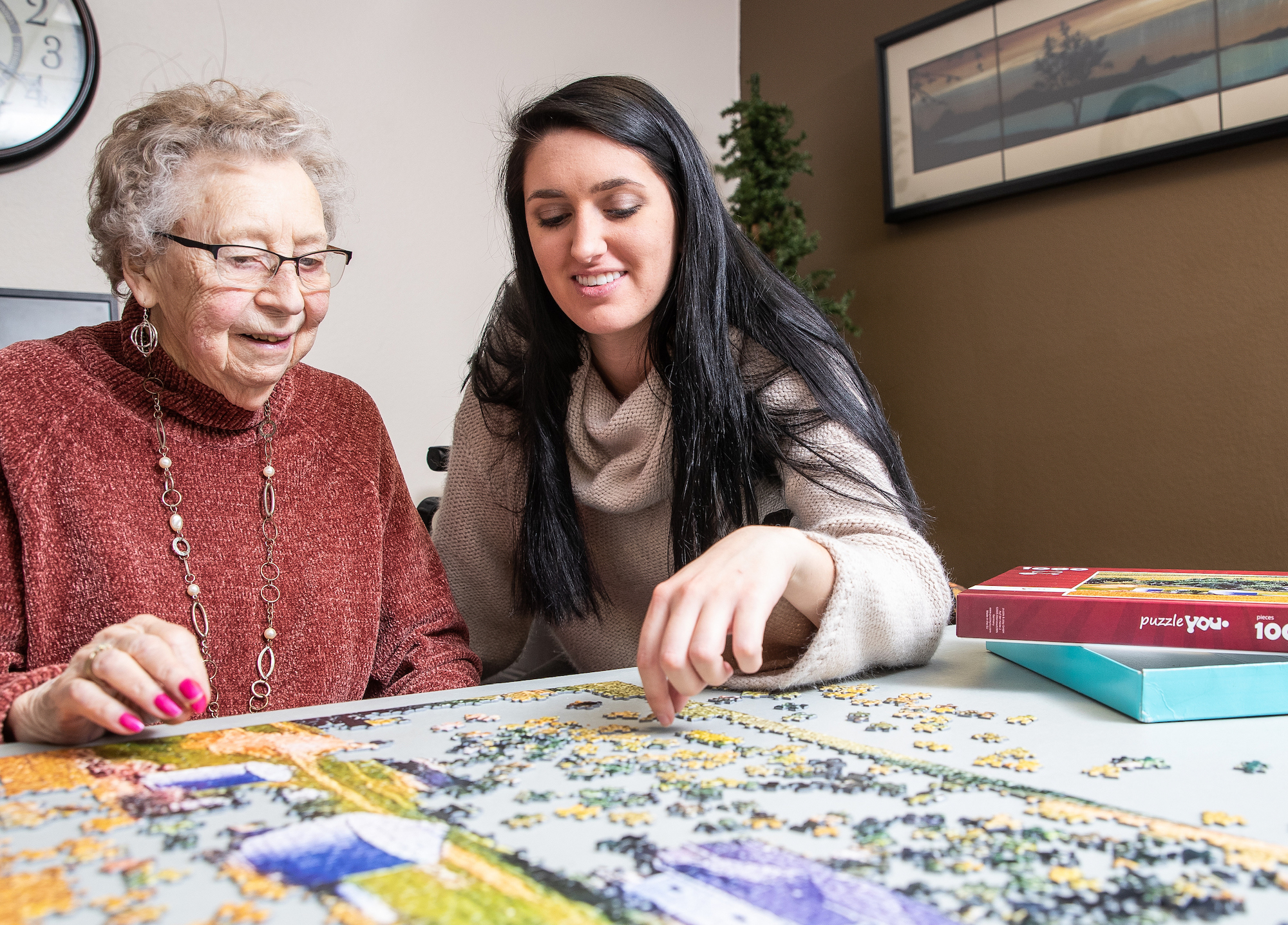 Gerontology student with aging care resident 