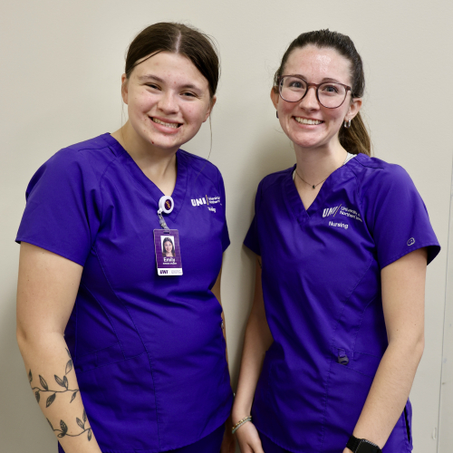 Two smiling nursing students